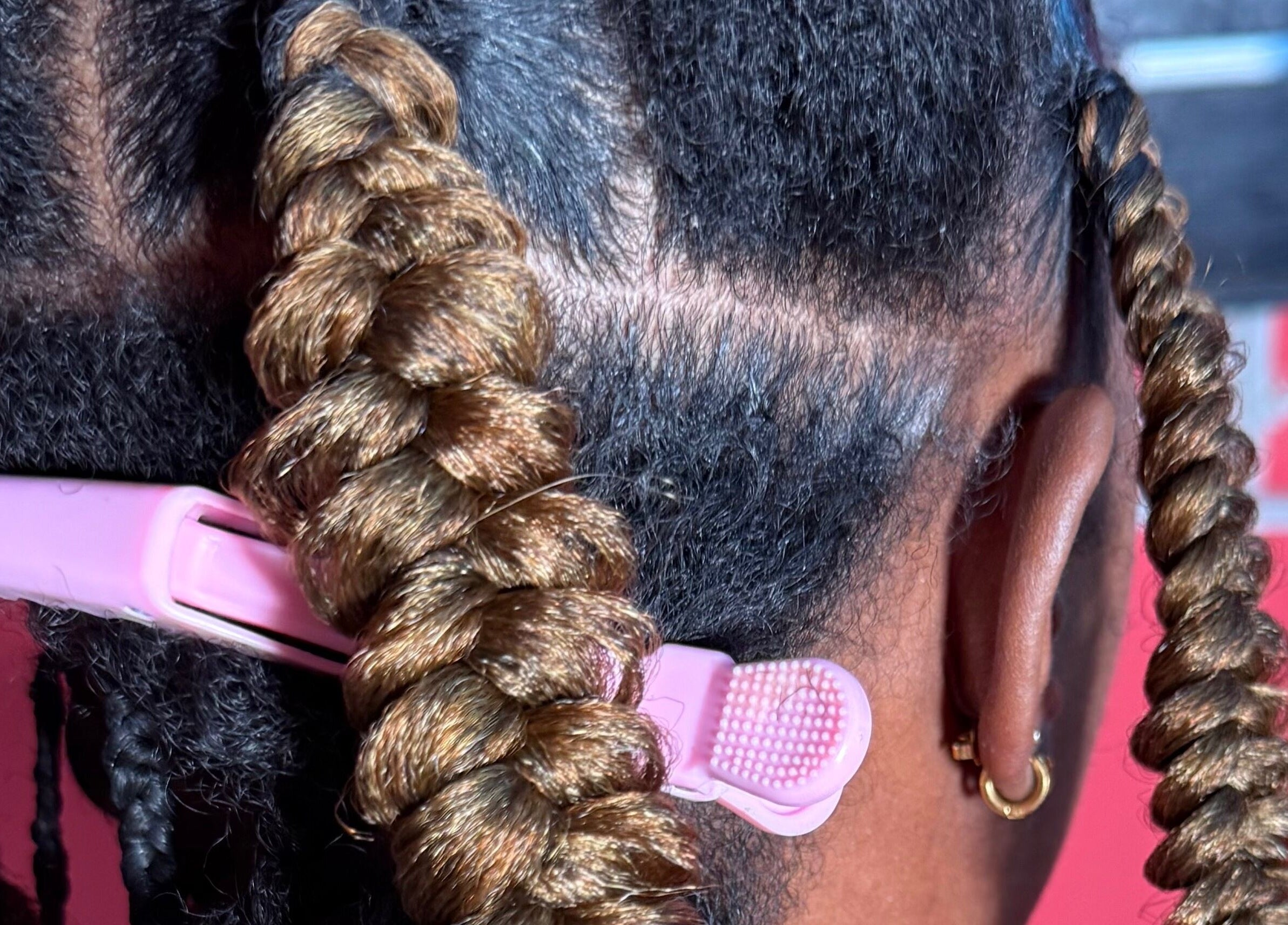 Detailed braid styling at K’Luxe Braid Boutique in Portmore, St. Catherine, JM, showcasing expert hair techniques.