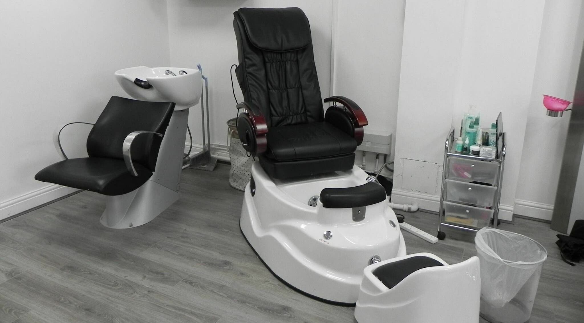 Modern salon pedicure chair and sink at Glamour Beauticians, Manchester, England, GB.