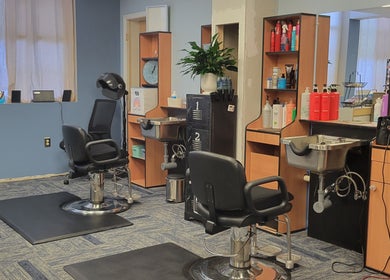 Inside Good Vibes Salon in Hanover, Pennsylvania, featuring modern styling stations and hair care products.