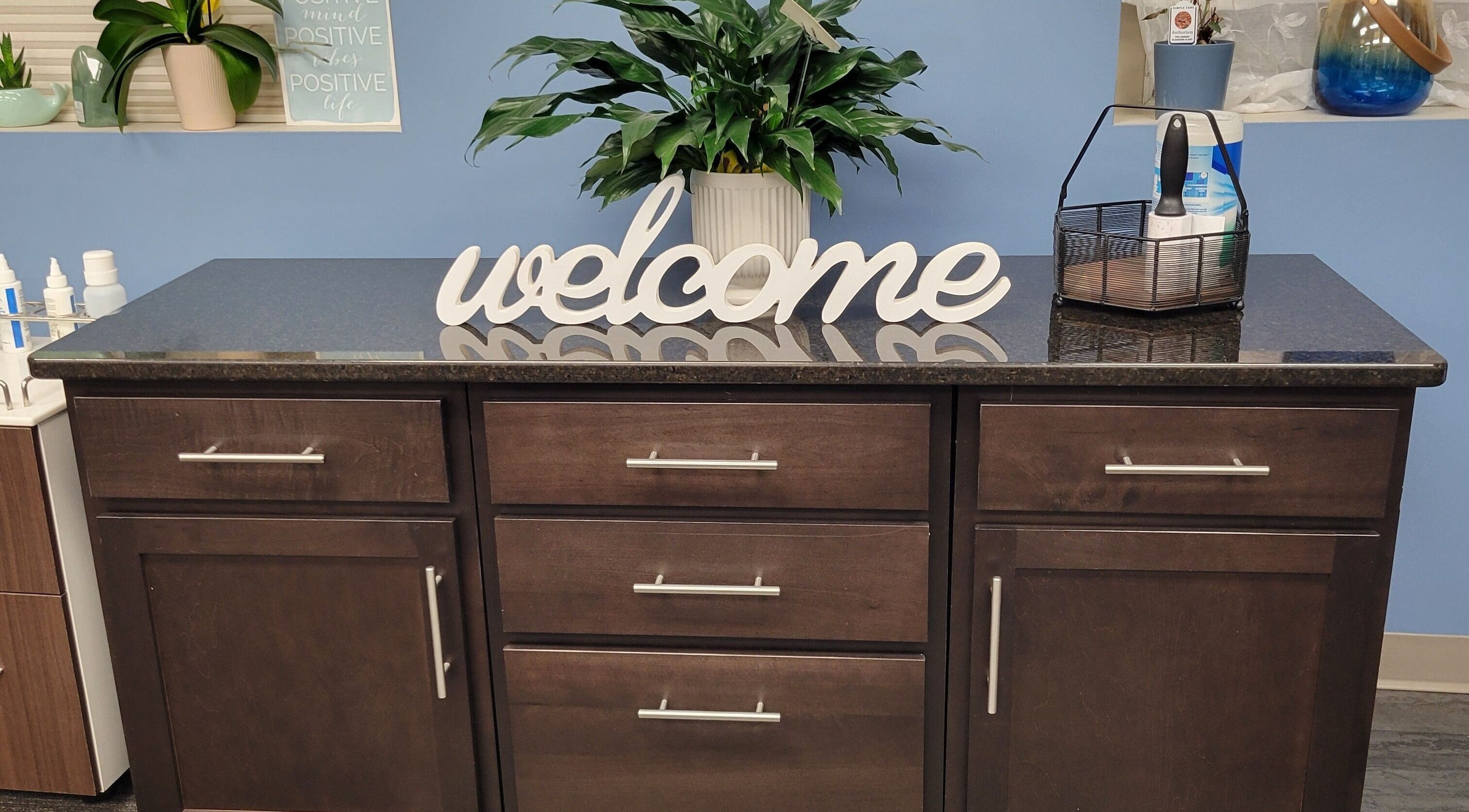 Welcome desk with plants at Good Vibes Salon, Hanover, Pennsylvania for a charming first impression.