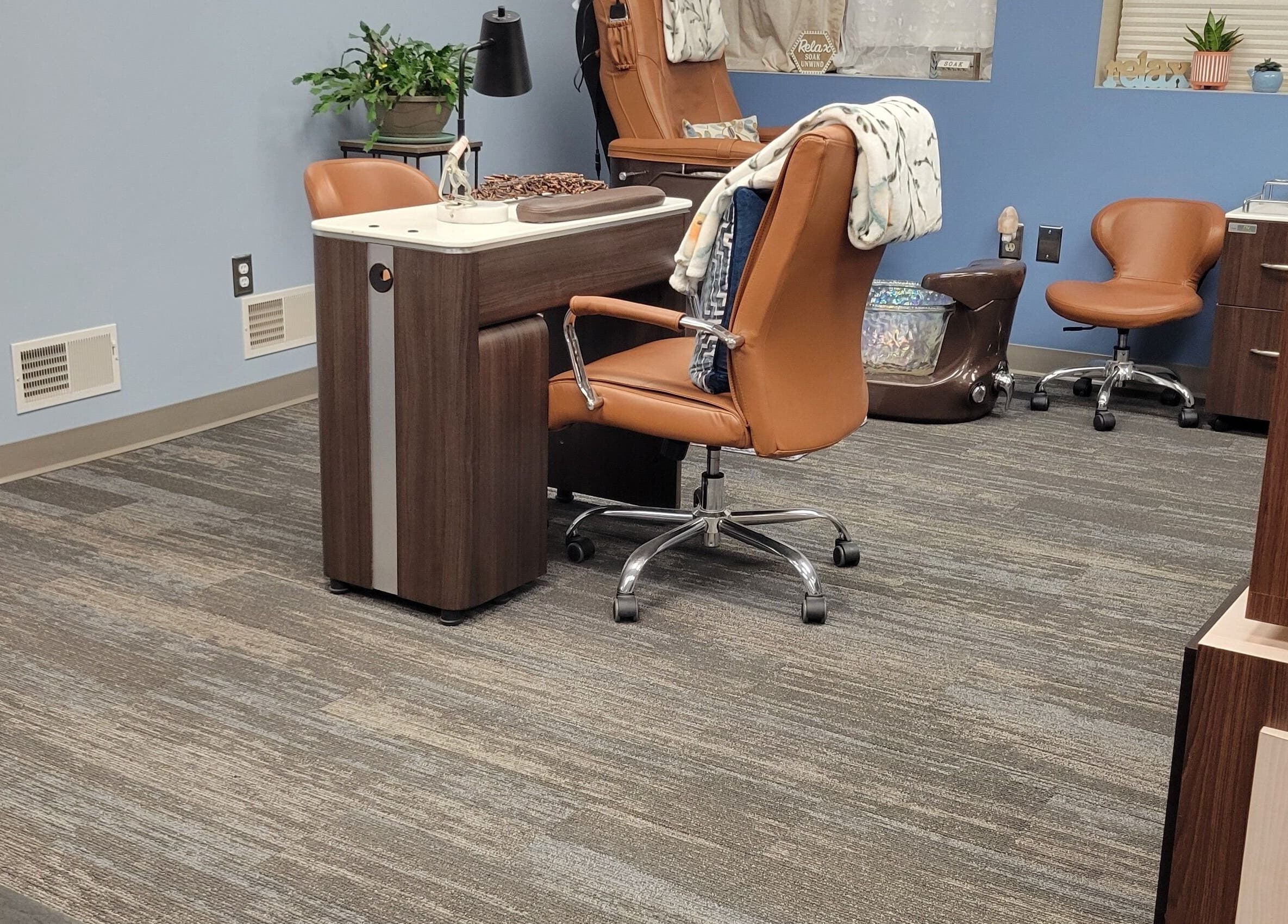 Tranquil nail station at Good Vibes Salon in Hanover, Pennsylvania, US with plush seating and modern decor.