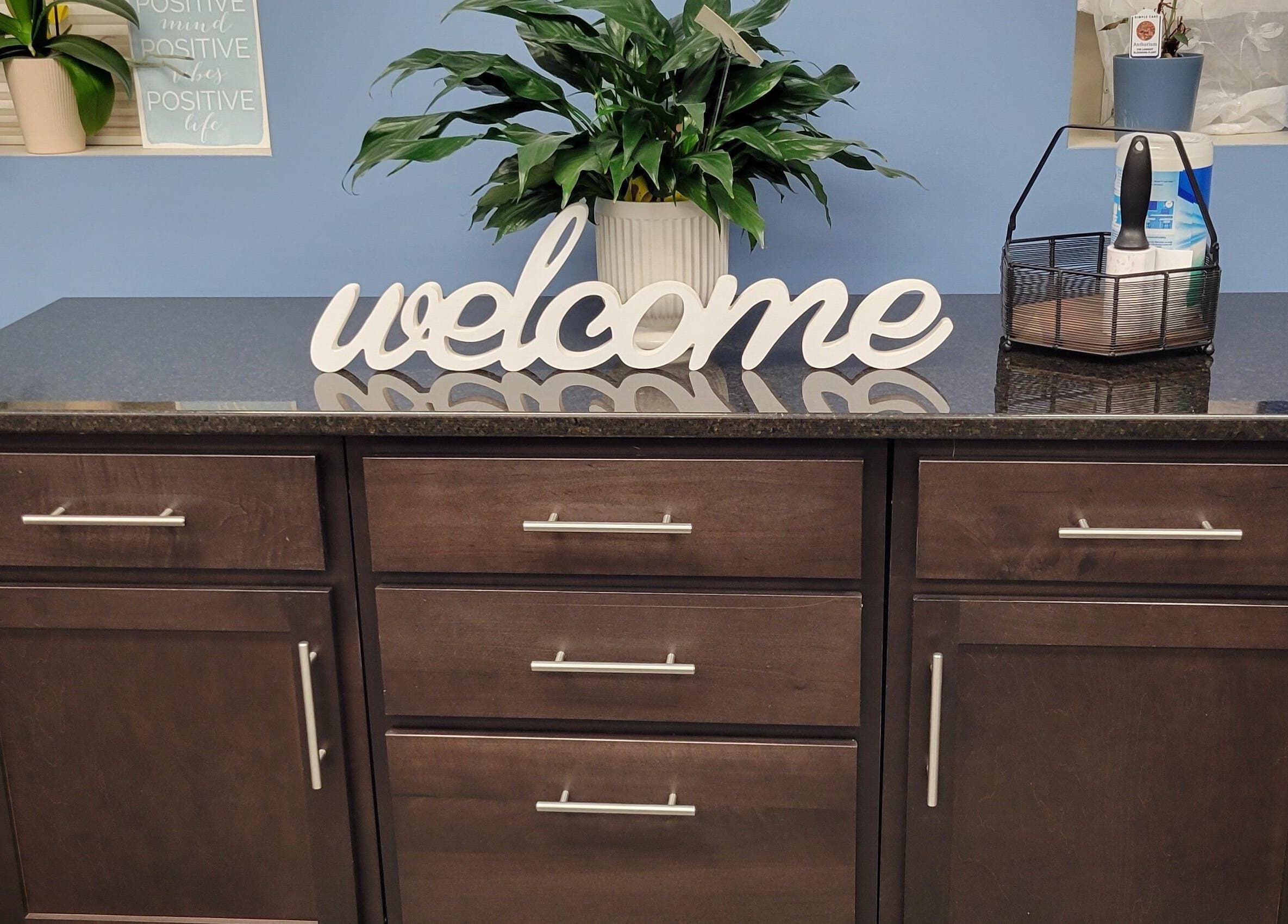 Welcome sign on counter at Good Vibes Salon, Hanover, Pennsylvania, US.