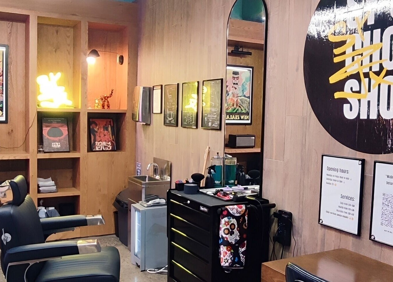 Interior of Sy's Chop Shop barber in Auckland, NZ, featuring modern decor and stylish seating.