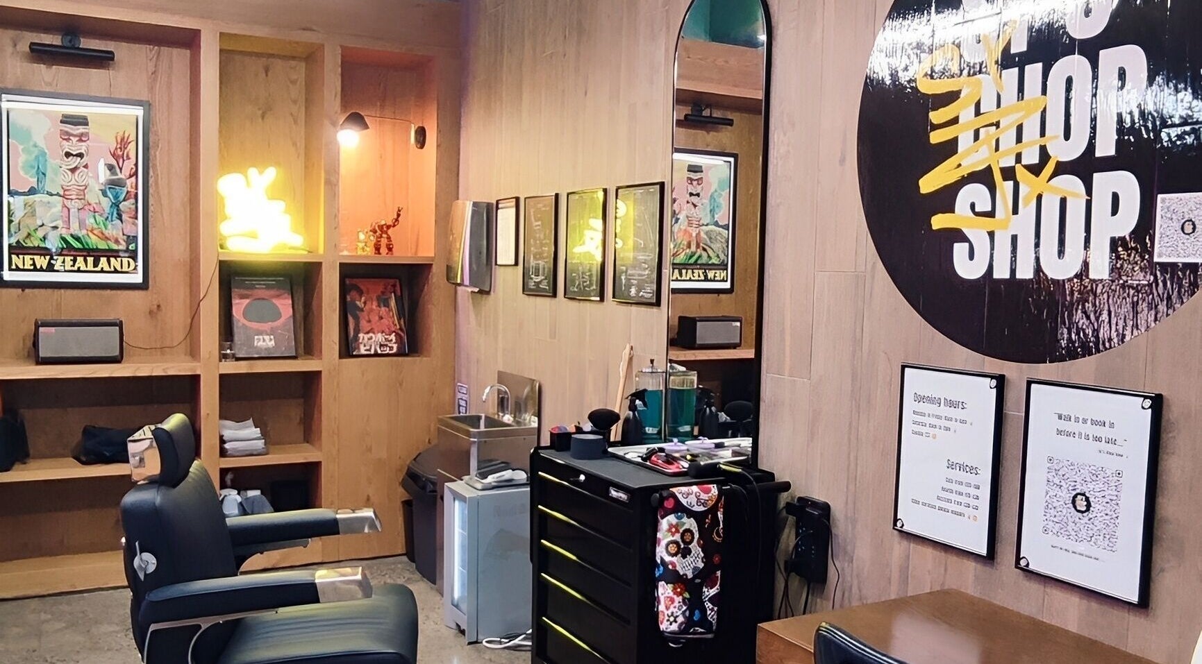 Interior of Sy's Chop Shop barber in Auckland, NZ, featuring modern decor and stylish seating.