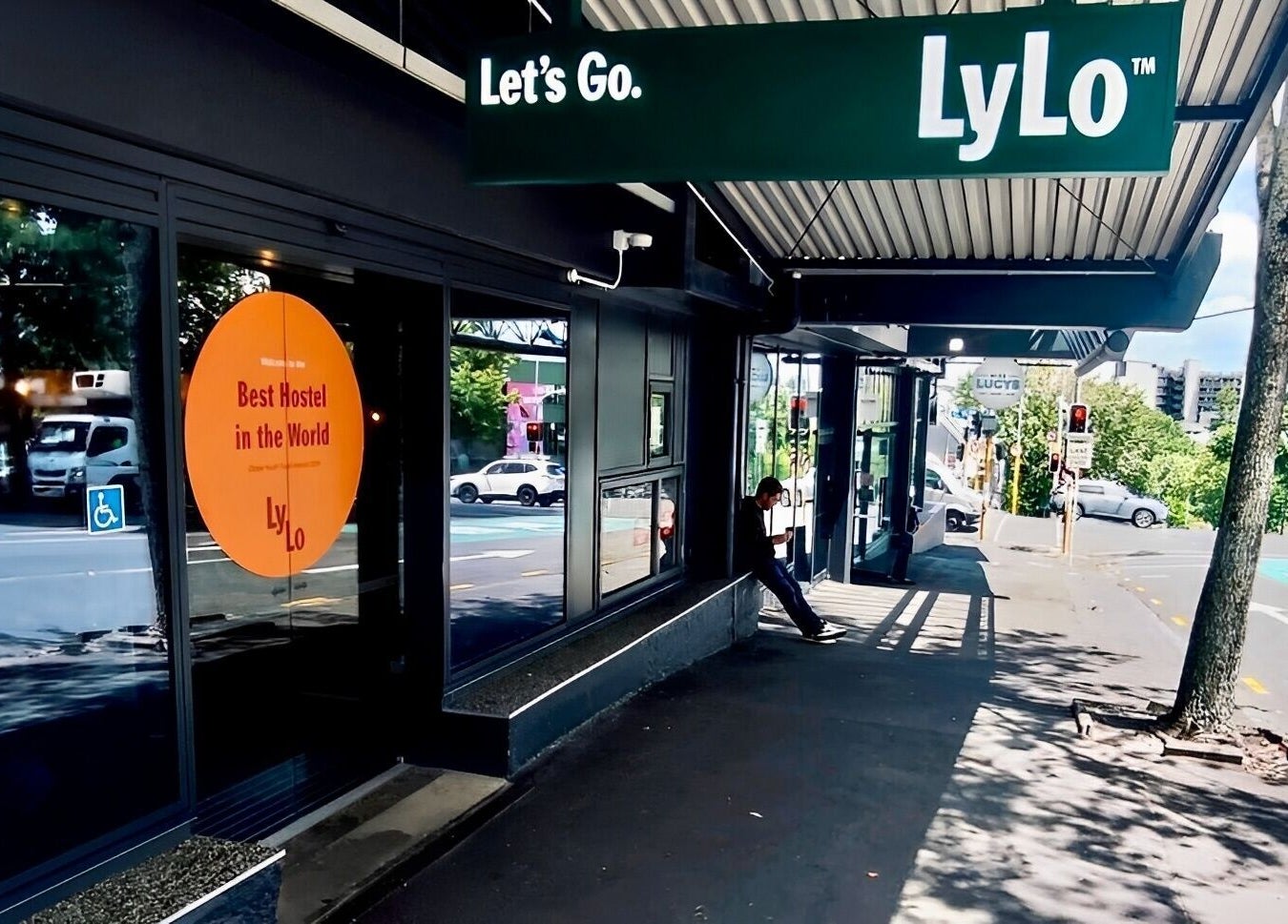 Street view of Sy's Chop Shop, Auckland, NZ, with modern decor and bustling surroundings.
