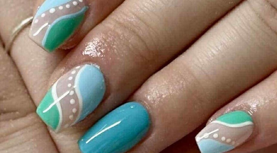 Artisan Nails custom ocean-themed design in Mosgiel, Otago, NZ featuring blue and green artistic patterns.