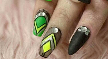 Vibrant gem-accented nail art at Artisan Nails, Mosgiel, Otago, NZ. Green and black geometric designs.