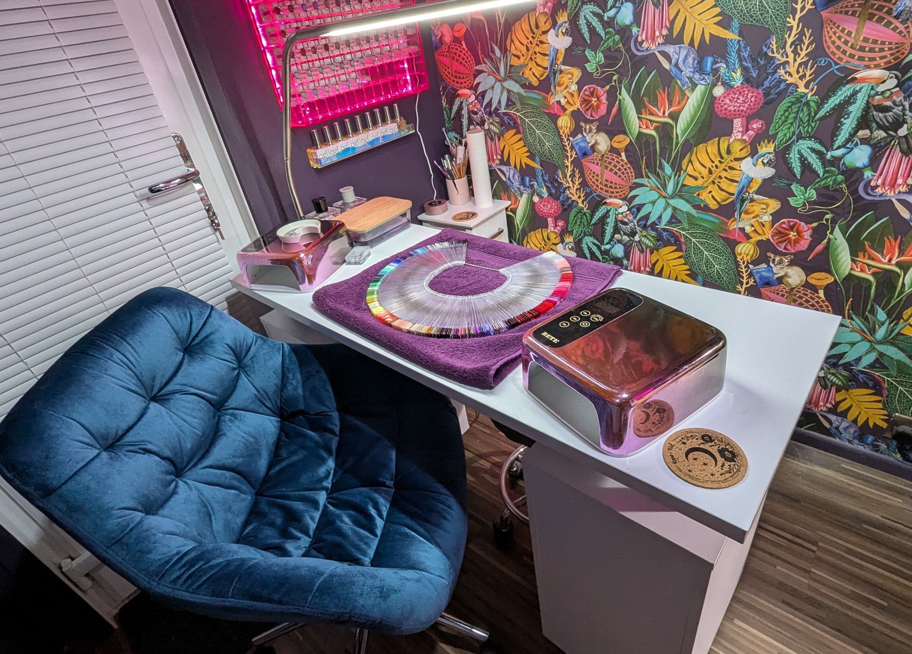 Stylish nail station at The Nailbox Netherton, Dudley, England, GB, with colorful decor and seating.
