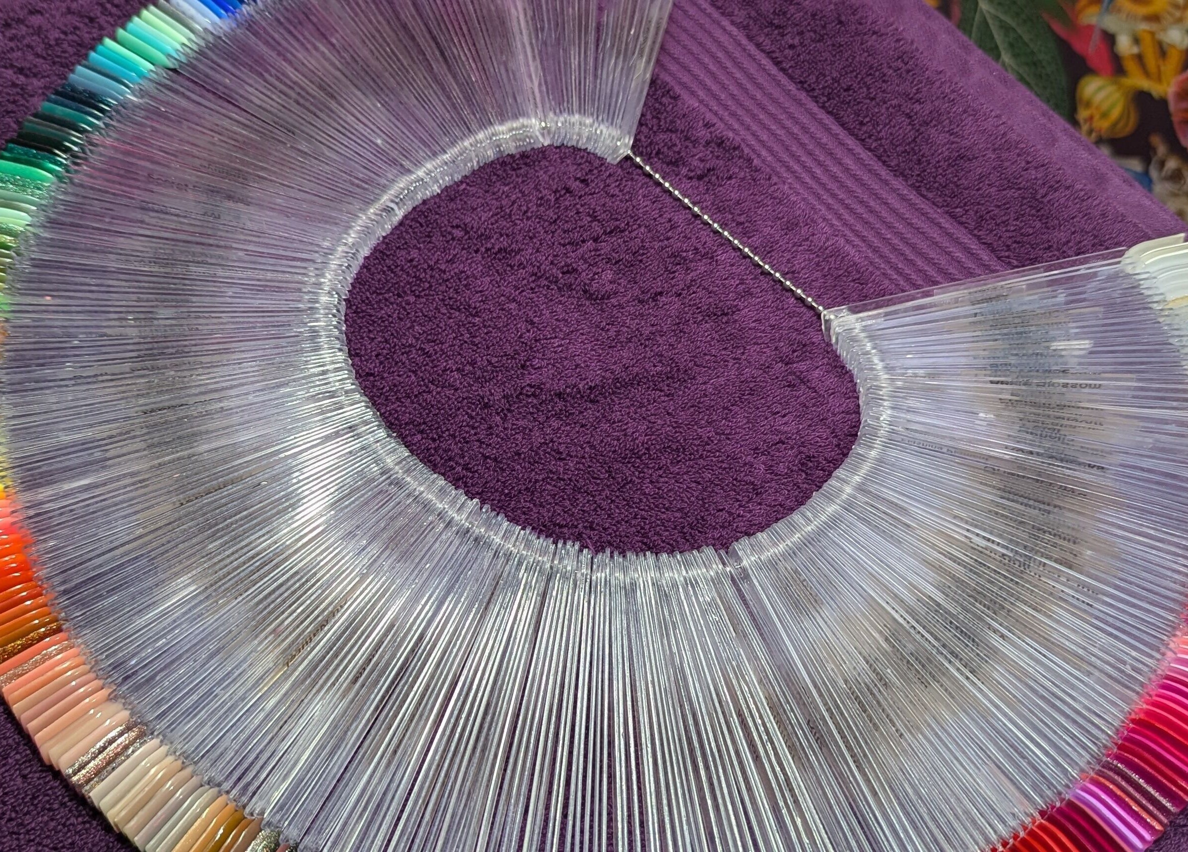 Colorful nail polish selection at The Nailbox Netherton, Dudley, England, GB, on a purple towel.