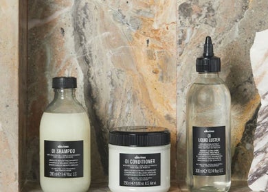 Hair care products display at Cora and Co, Teignmouth, England, GB. Featuring shampoo, conditioner, and liquid luster.