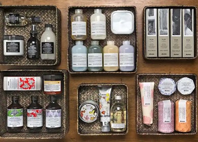 High-end beauty products in wicker baskets at Cora and Co, Teignmouth, England, GB.