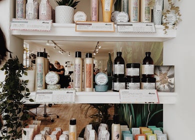 Cora and Co product display shelf in Teignmouth, England, GB showcasing premium hair and skincare items.