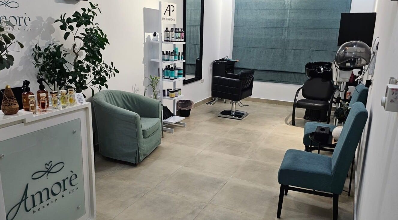 Amore Spa interior with chic seating and products, Muscat, Muscat Governorate, OM.