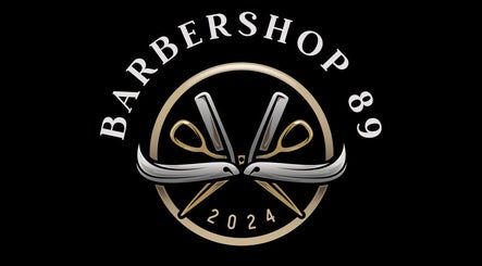 Barbershop 89 logo with scissors emblem in Hamilton, Ontario, CA. Sophisticated design.