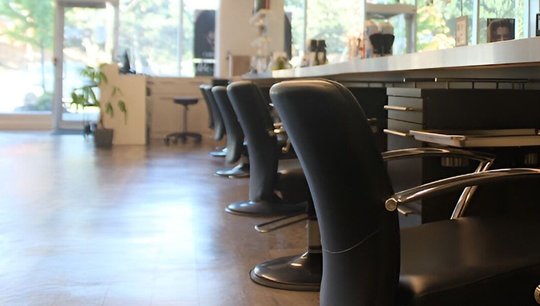 Elegant black salon chairs at DBK Salon Bayview in Toronto, Ontario, CA offering a relaxing atmosphere.