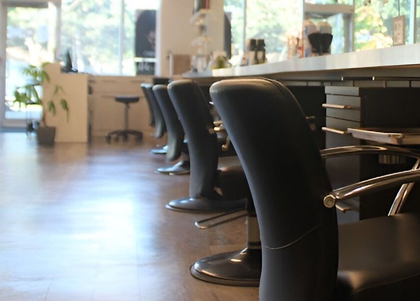 Elegant black salon chairs at DBK Salon Bayview in Toronto, Ontario, CA offering a relaxing atmosphere.