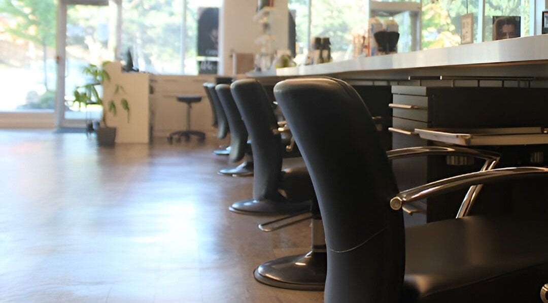Elegant black salon chairs at DBK Salon Bayview in Toronto, Ontario, CA offering a relaxing atmosphere.