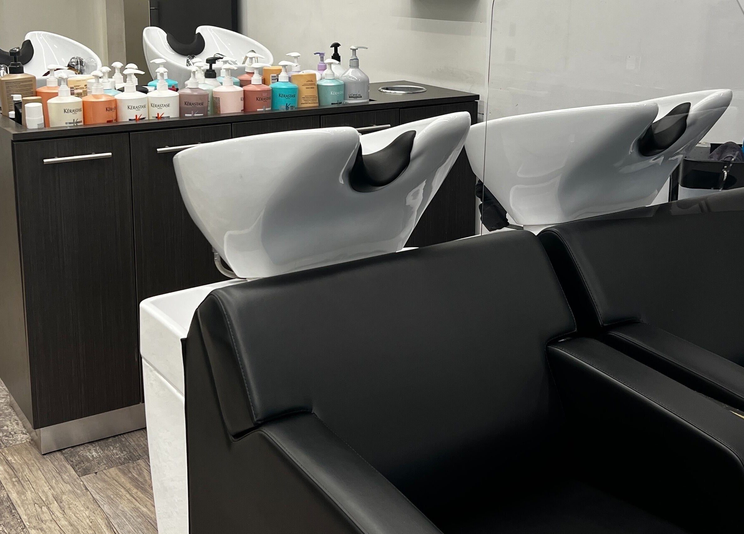Modern shampoo stations at DBK Salon Bayview in Toronto, Ontario, CA, offering a luxurious hair treatment experience.