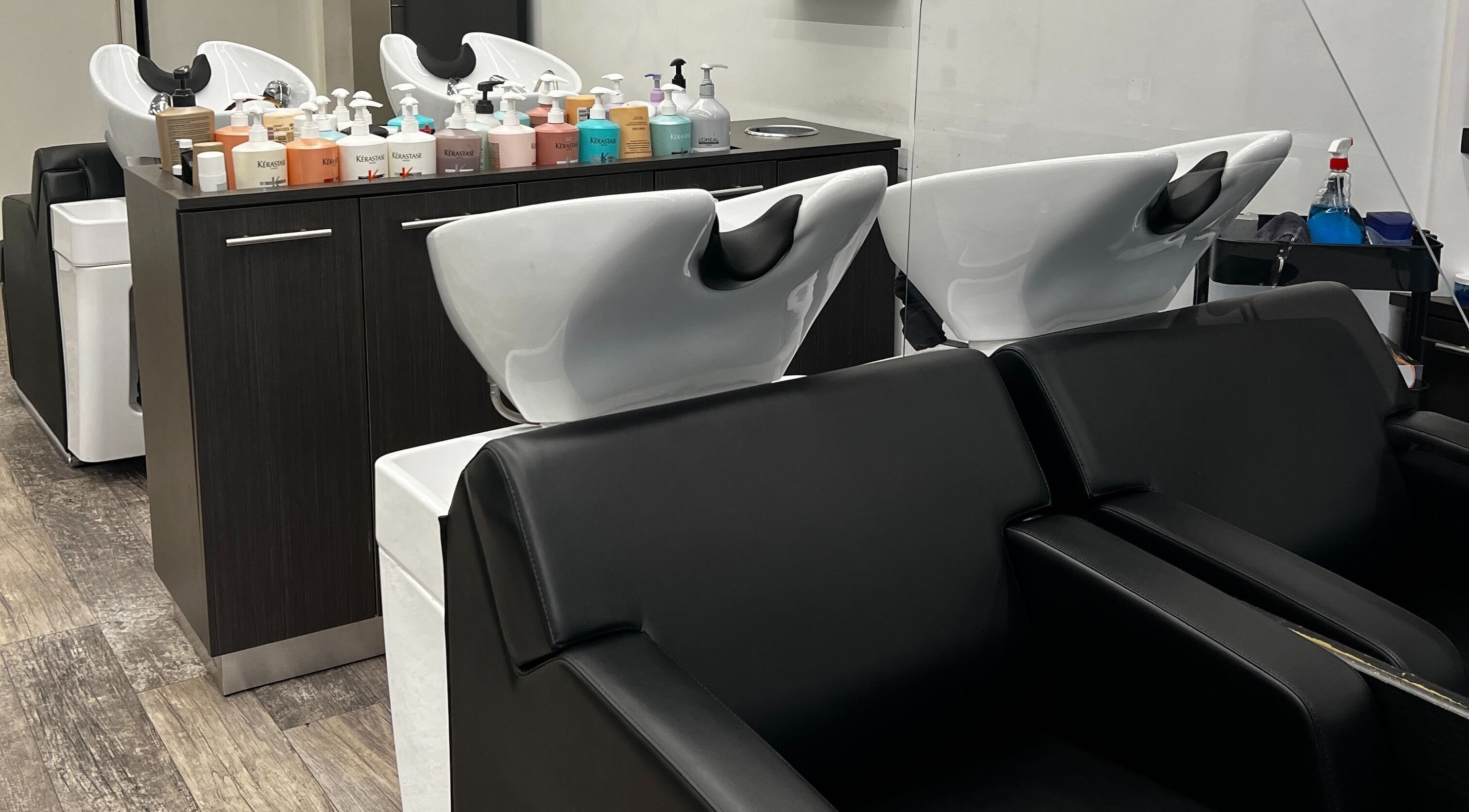 Modern shampoo stations at DBK Salon Bayview in Toronto, Ontario, CA, offering a luxurious hair treatment experience.