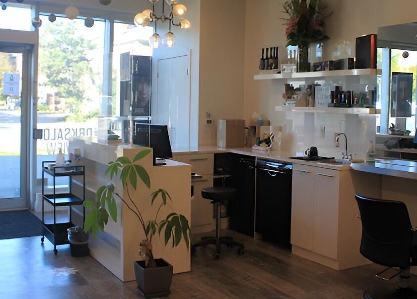 Bright and stylish interior of DBK Salon Bayview, Toronto, Ontario, CA with modern design and greenery.