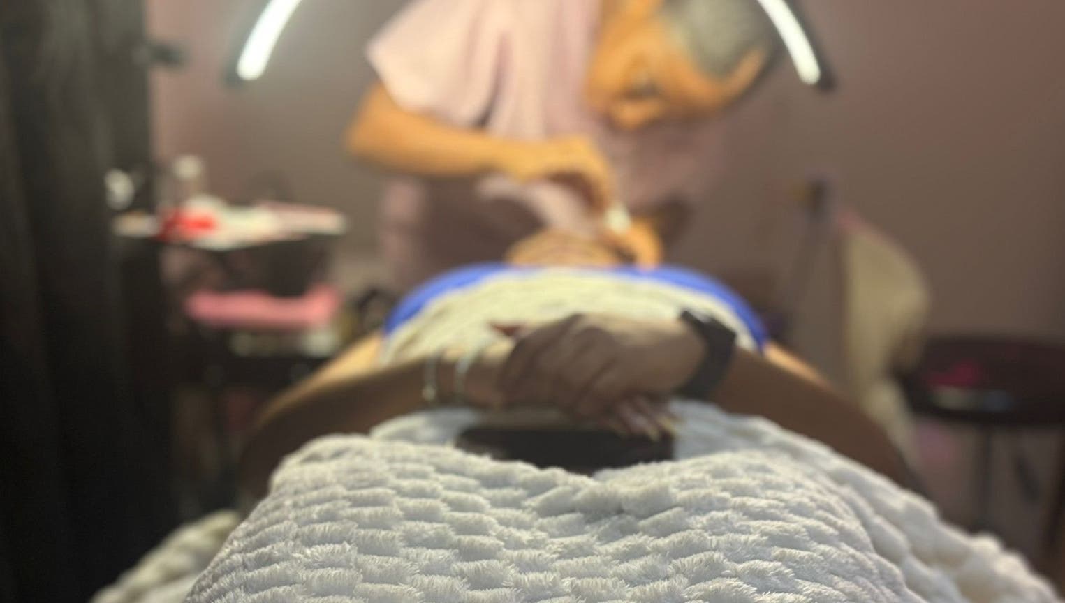 Client receiving face treatment at VR Beauty Room in Willemstad, Curaçao, CW.