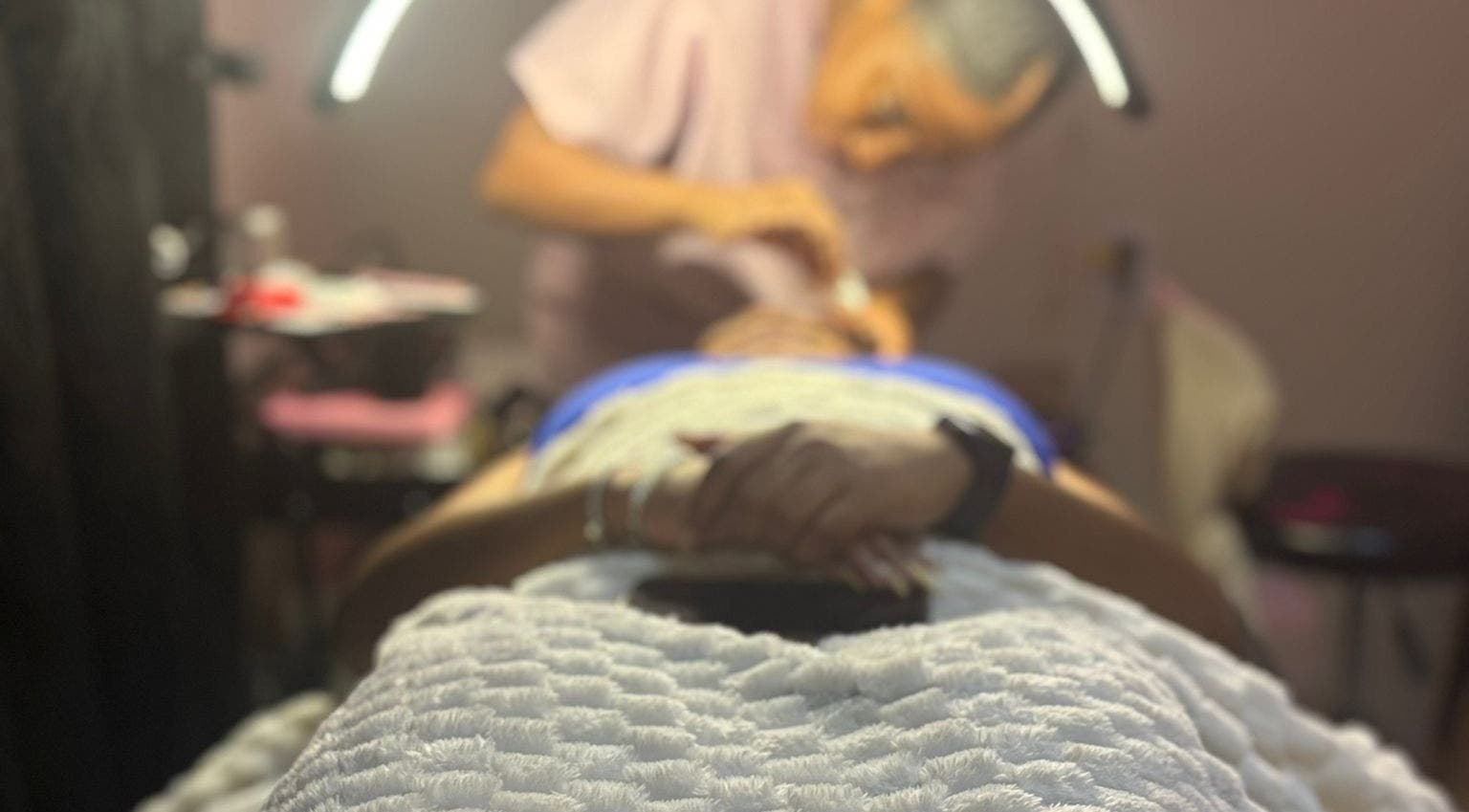 Client receiving face treatment at VR Beauty Room in Willemstad, Curaçao, CW.