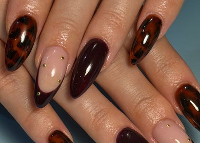 Stylish tortoiseshell nail art by Nails by Emeli, Halfway, England, GB, showcasing intricate design and vibrant colors.