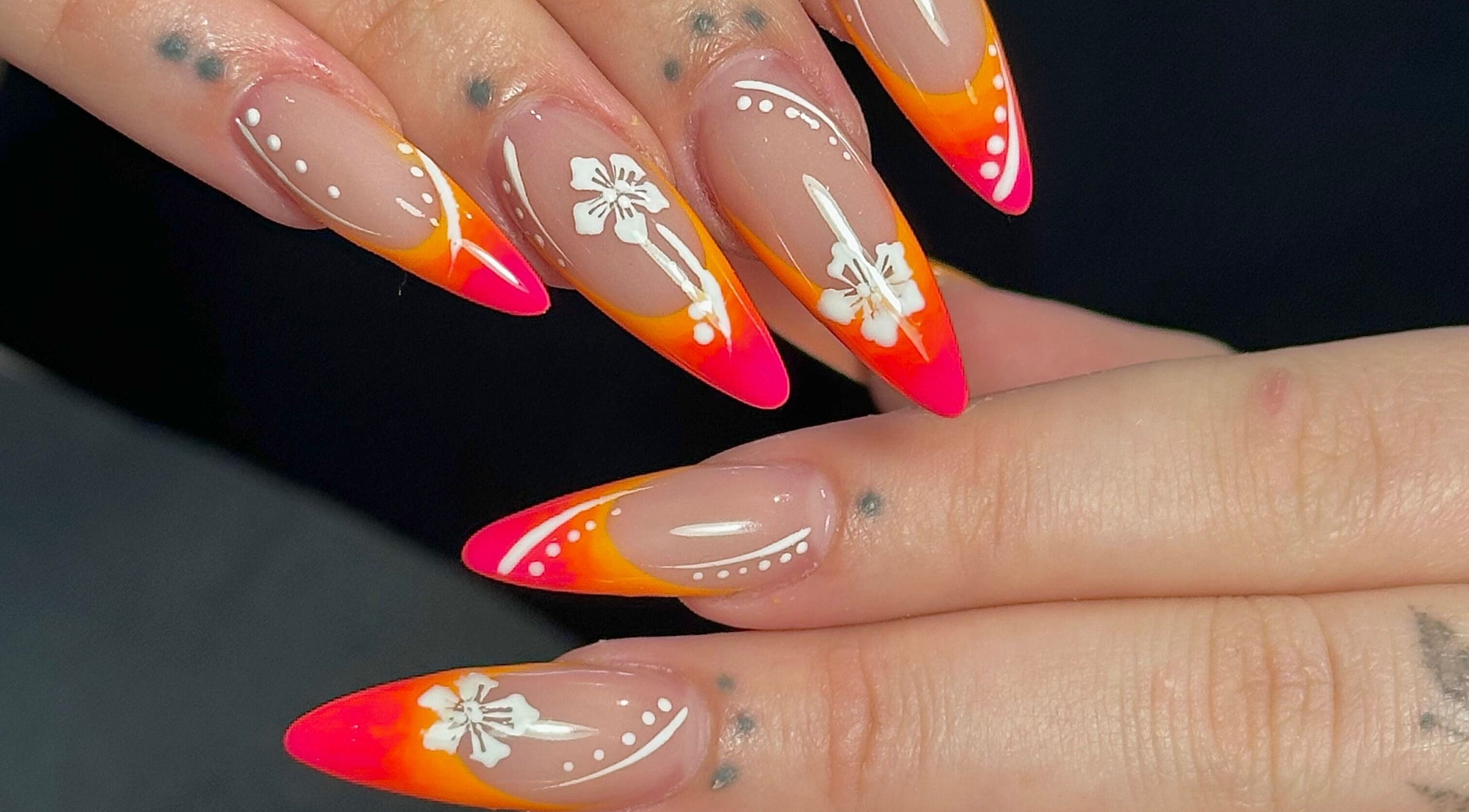 Colorful floral nail art by Nails by Emeli at Halfway, England, GB showcases bright orange and pink designs.
