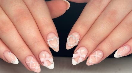 Intricate nail art with pearls and bows at Nails by Emeli, Halfway, England, GB.