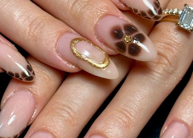 Stylish nail art with gold accents at Nails by Emeli, Halfway, England, GB.