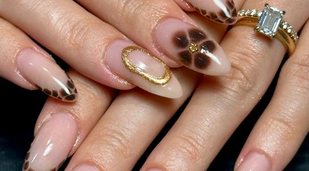 Stylish nail art with gold accents at Nails by Emeli, Halfway, England, GB.