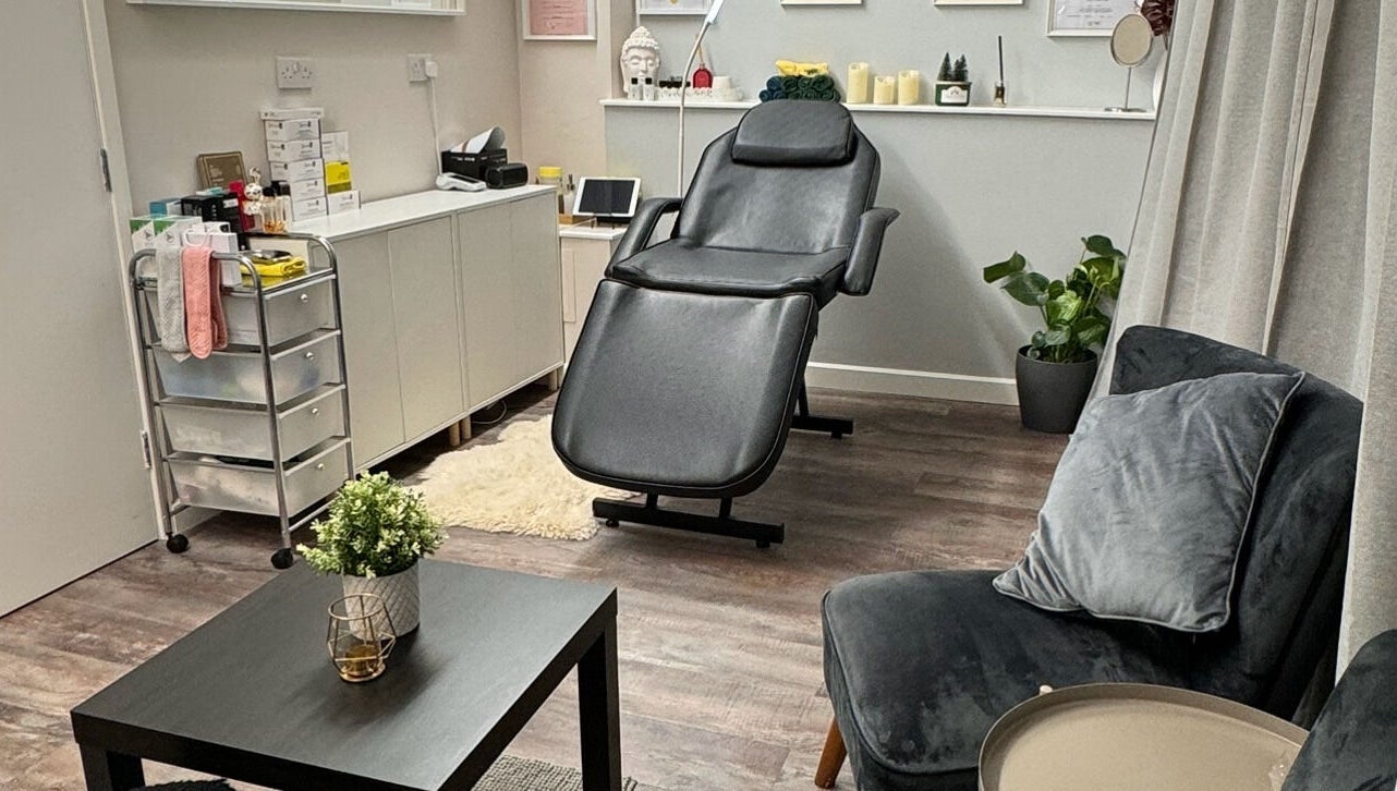 Relaxing treatment room at Beayou clinic, Bromley, England, GB with plush seating and modern decor.