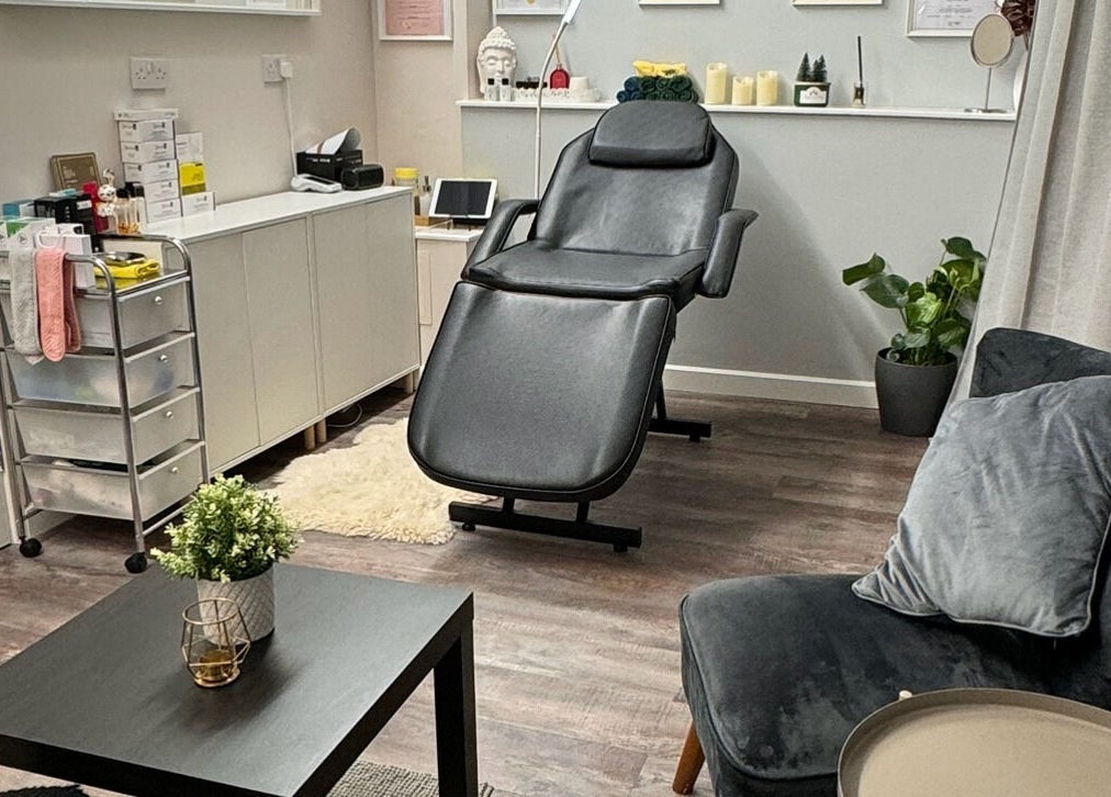 Relaxing treatment room at Beayou clinic, Bromley, England, GB with plush seating and modern decor.