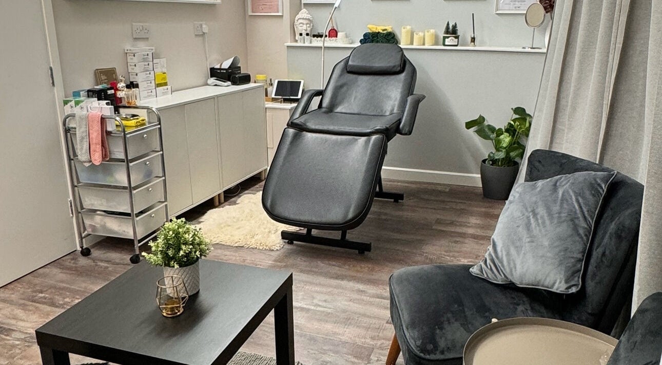 Relaxing treatment room at Beayou clinic, Bromley, England, GB with plush seating and modern decor.