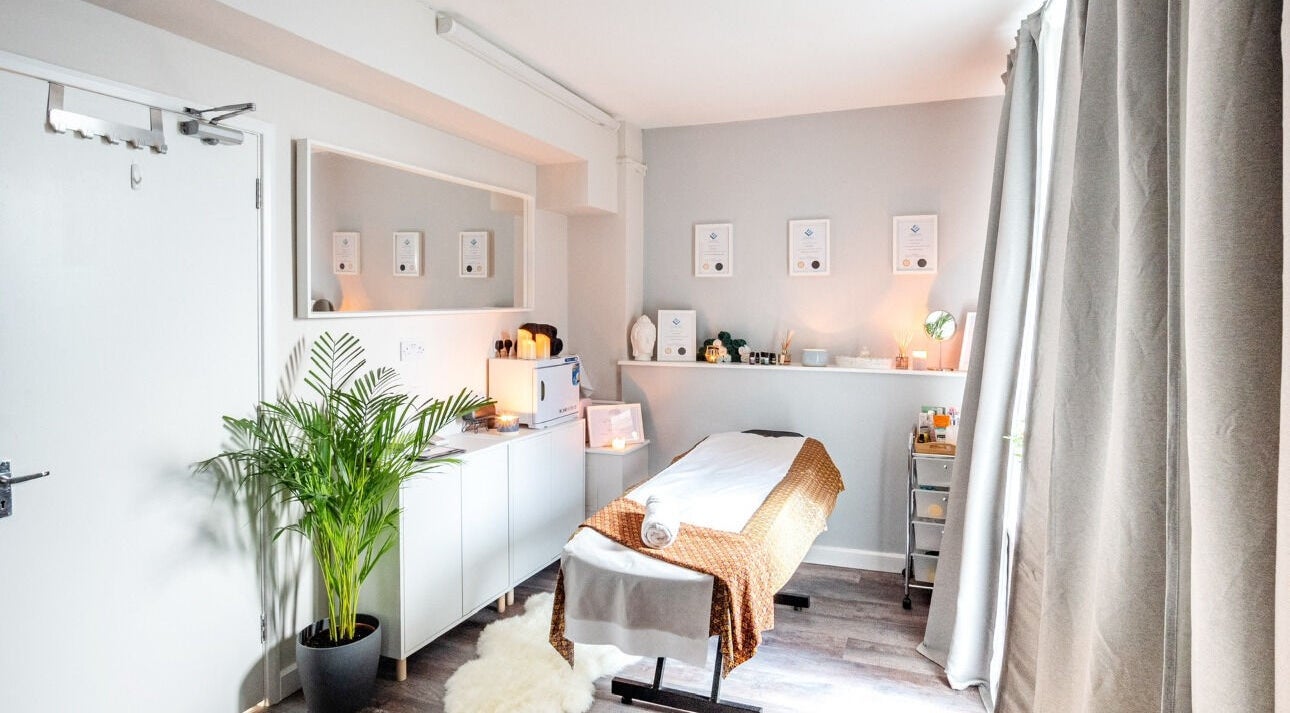 Tranquil treatment room at Beayou clinic in Bromley, England, GB with cozy decor and ambient lighting.