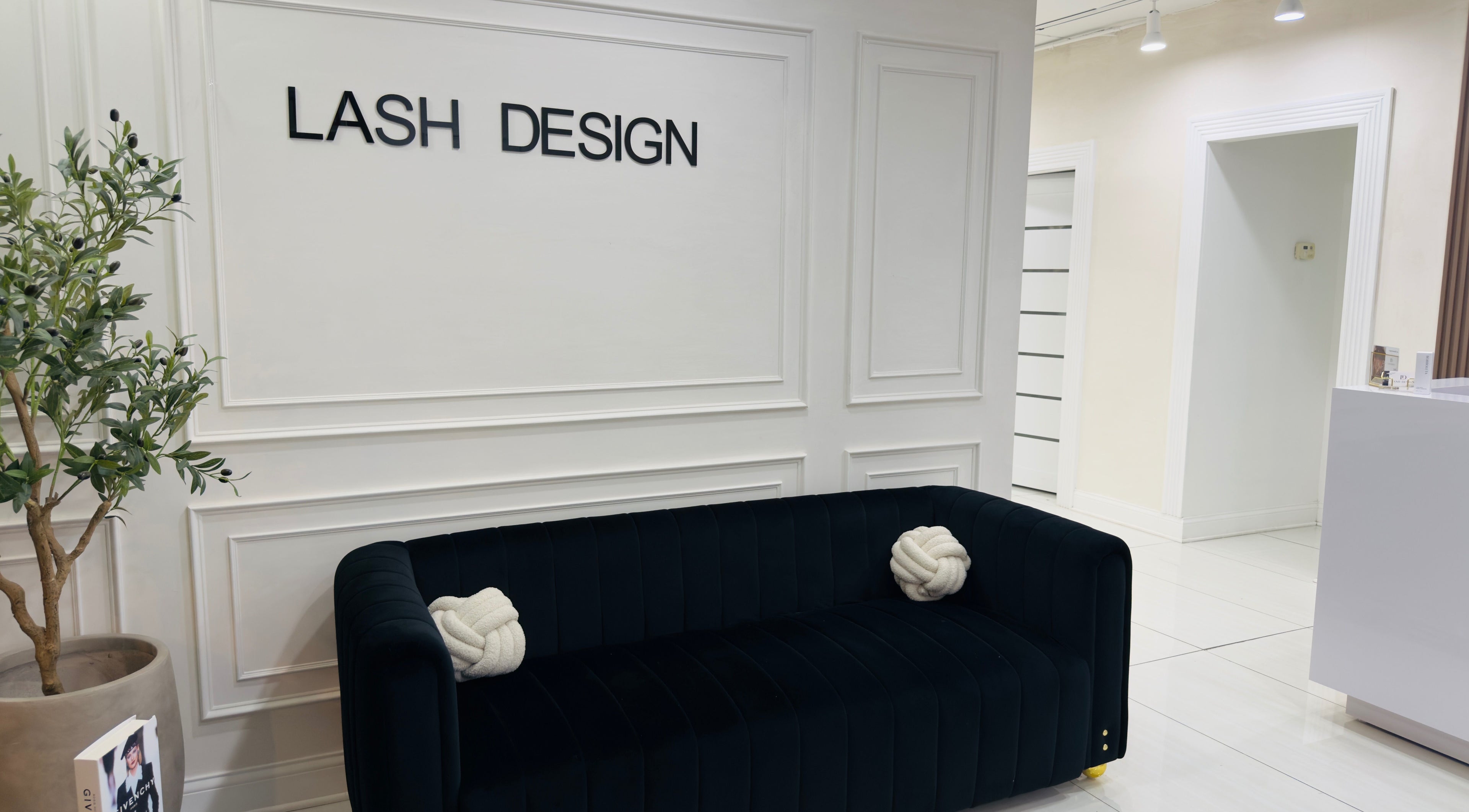 Sleek waiting area at Lash Design -River North in Chicago, Illinois, US, showcasing modern decor and cozy seating.