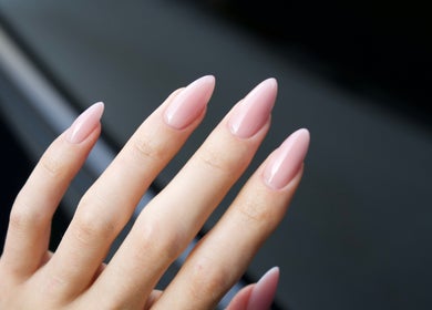 Elegant pink manicure at Lash Design -River North, Chicago, Illinois, US. Perfectly shaped glossy nails.