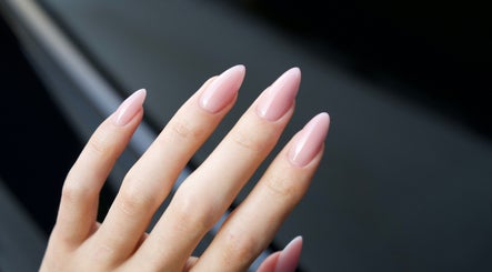 Elegant pink manicure at Lash Design -River North, Chicago, Illinois, US. Perfectly shaped glossy nails.