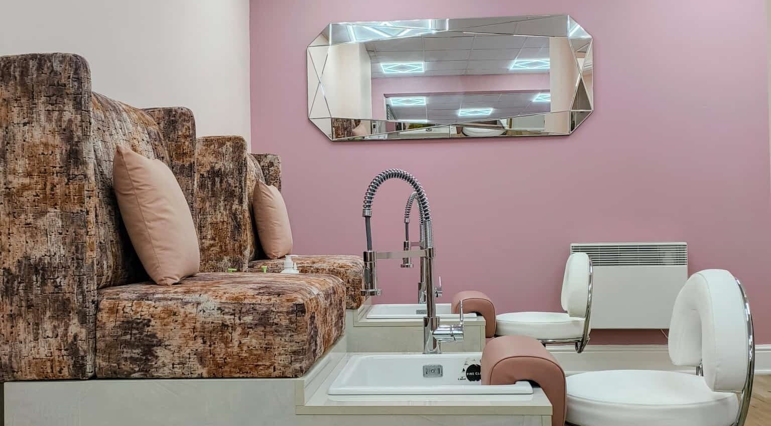 Luxurious pedicure chairs in Lotus Salon, Leicester, England, GB, offering comfort and style.