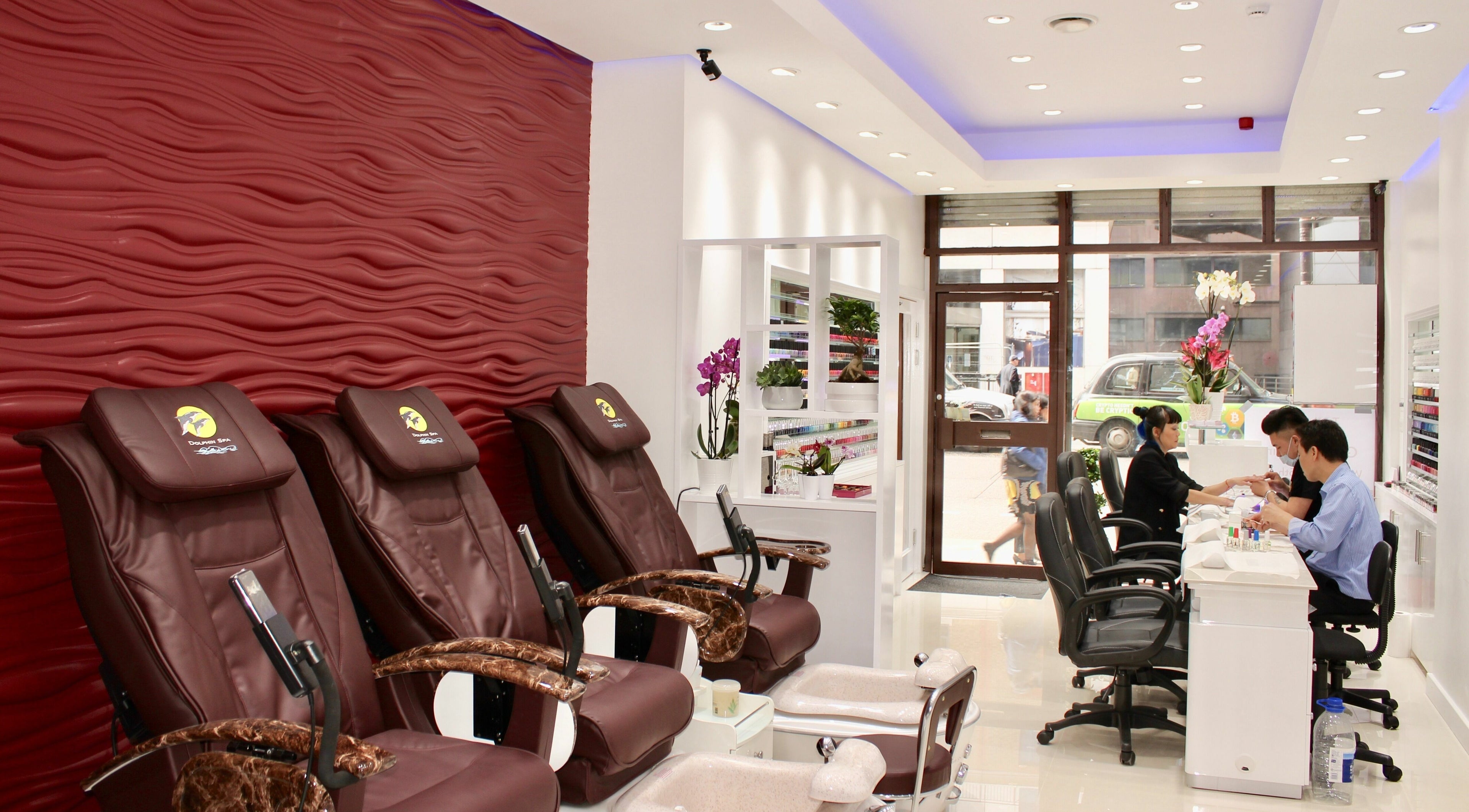 Relaxing pedicure chairs inside Tri An Bespoke Nail Bar in London, England, GB, showcasing modern elegance.