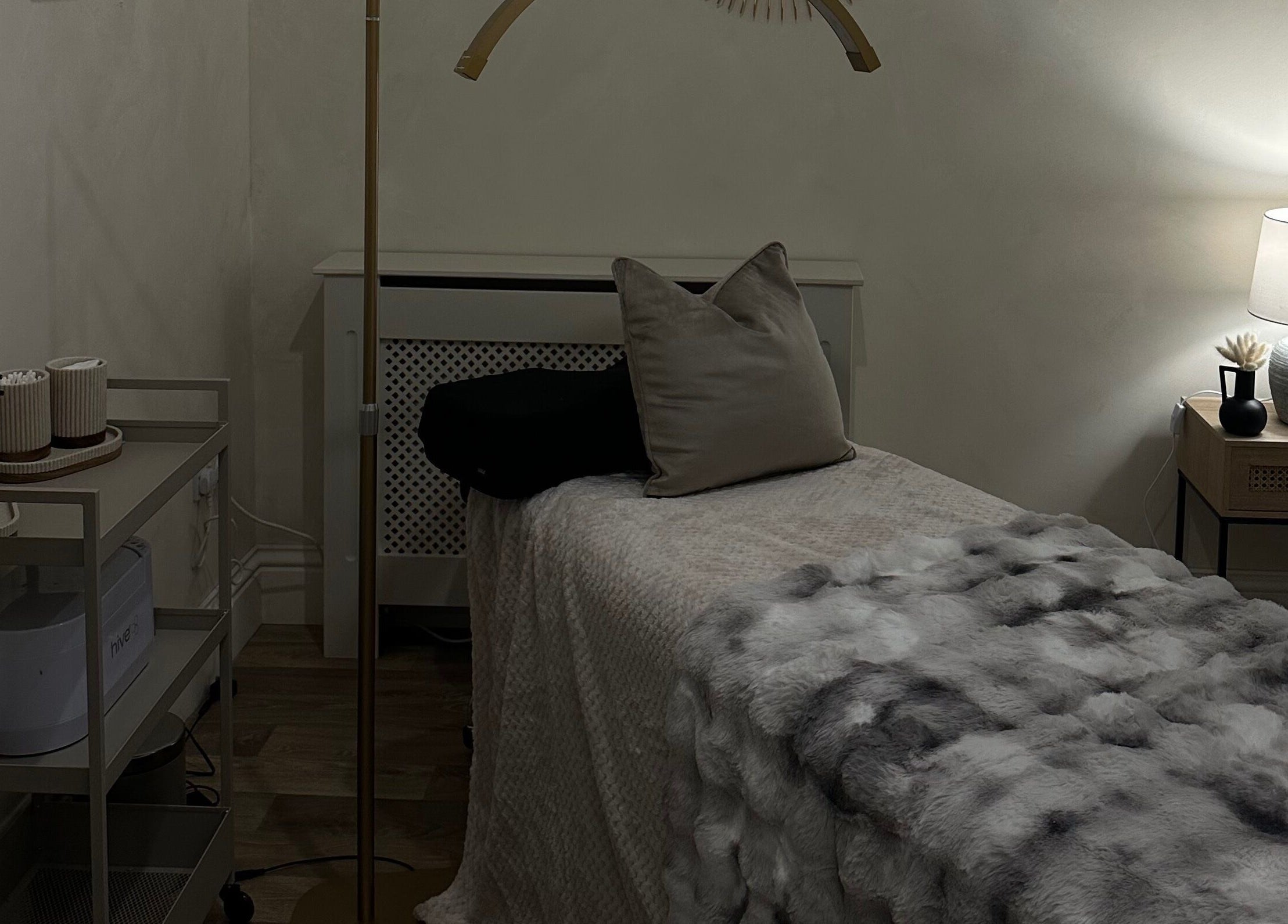 Relaxing spa room at Coconut & Co, Penrith, England, GB, featuring a softly lit massage table and stylish decor.