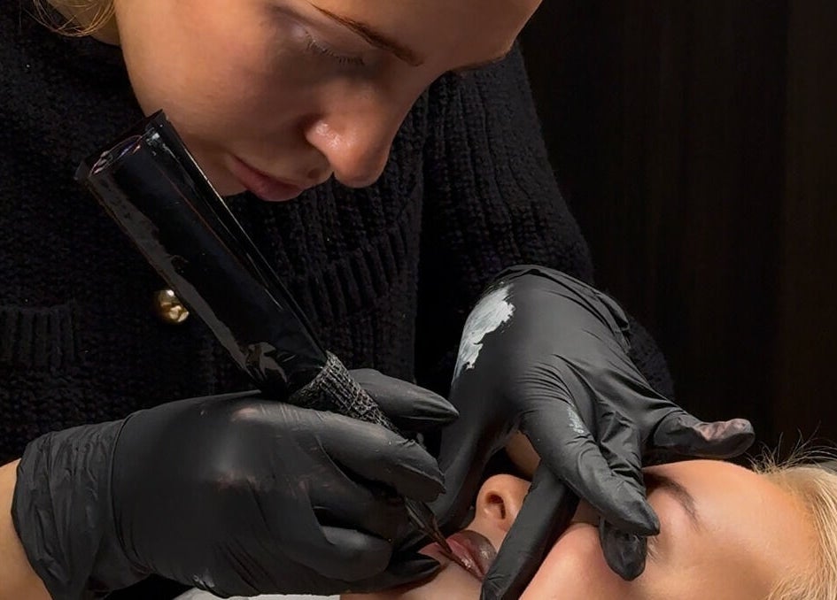 Expert applying lip tattoo at Coconut & Co, Penrith, England, GB, ensuring flawless beauty and precision.