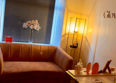 Elegant lounge at The Glow Room by Danielle in Pontypridd, Wales, GB featuring a plush sofa and ambient lighting.