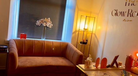 Elegant lounge at The Glow Room by Danielle in Pontypridd, Wales, GB featuring a plush sofa and ambient lighting.