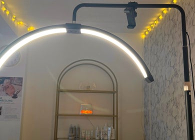 Elegant treatment room at The Glow Room by Danielle, Pontypridd, Wales, GB with soothing lighting and beauty products.