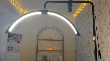 Elegant treatment room at The Glow Room by Danielle, Pontypridd, Wales, GB with soothing lighting and beauty products.