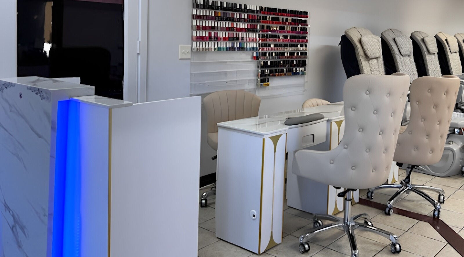 Elegant nail salon setup at Diva Nails in Methuen, Massachusetts, US with plush chairs and nail polish display.