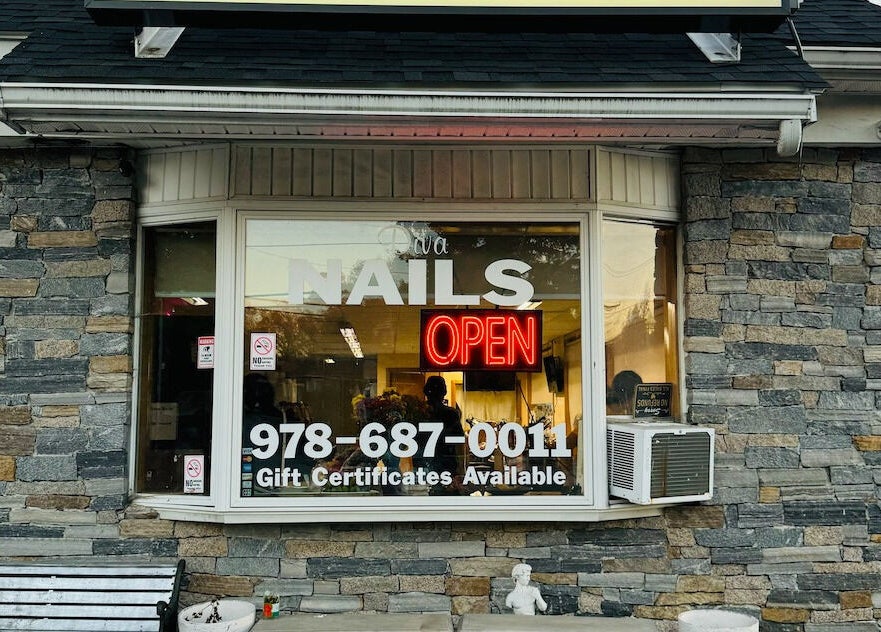 Front view of Diva Nails with neon open sign, Methuen, Massachusetts, US.