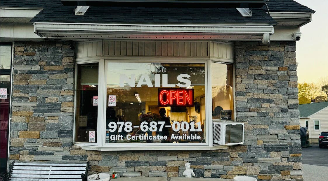 Front view of Diva Nails with neon open sign, Methuen, Massachusetts, US.