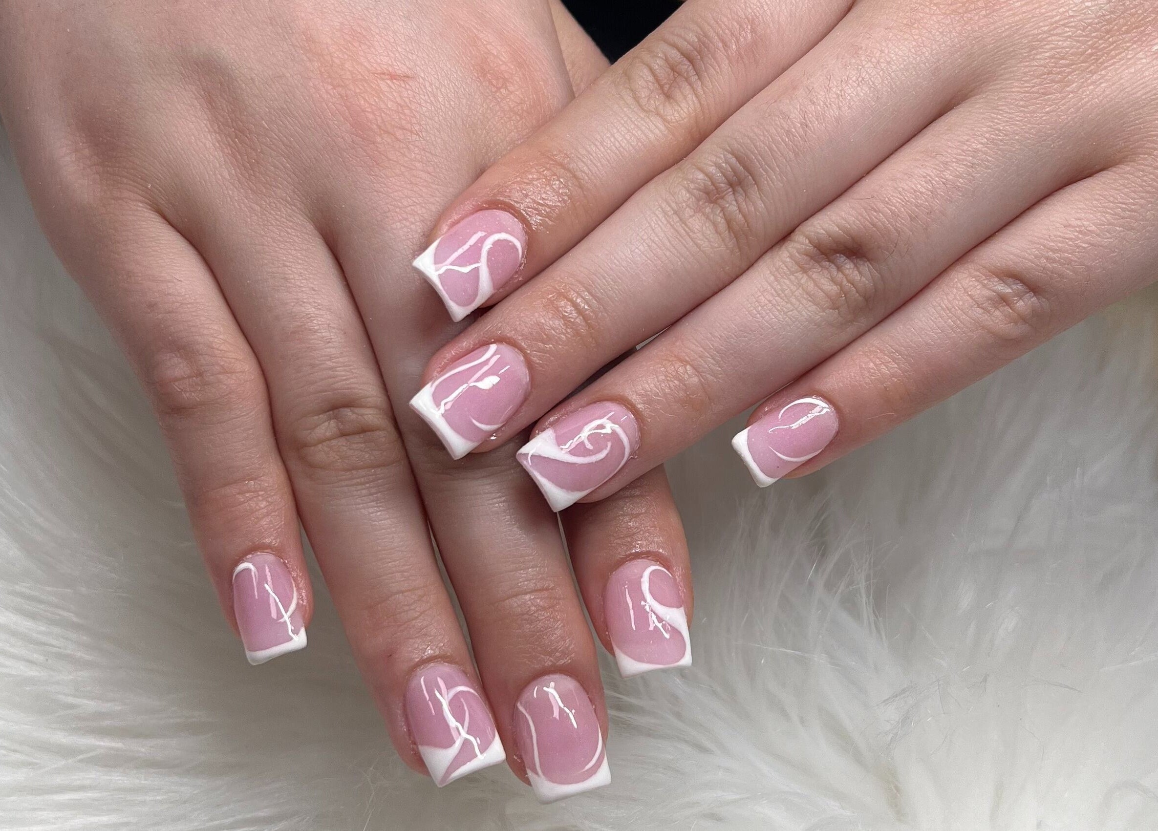 Elegant pink and white nail art at Diva Nails in Methuen, Massachusetts, US.